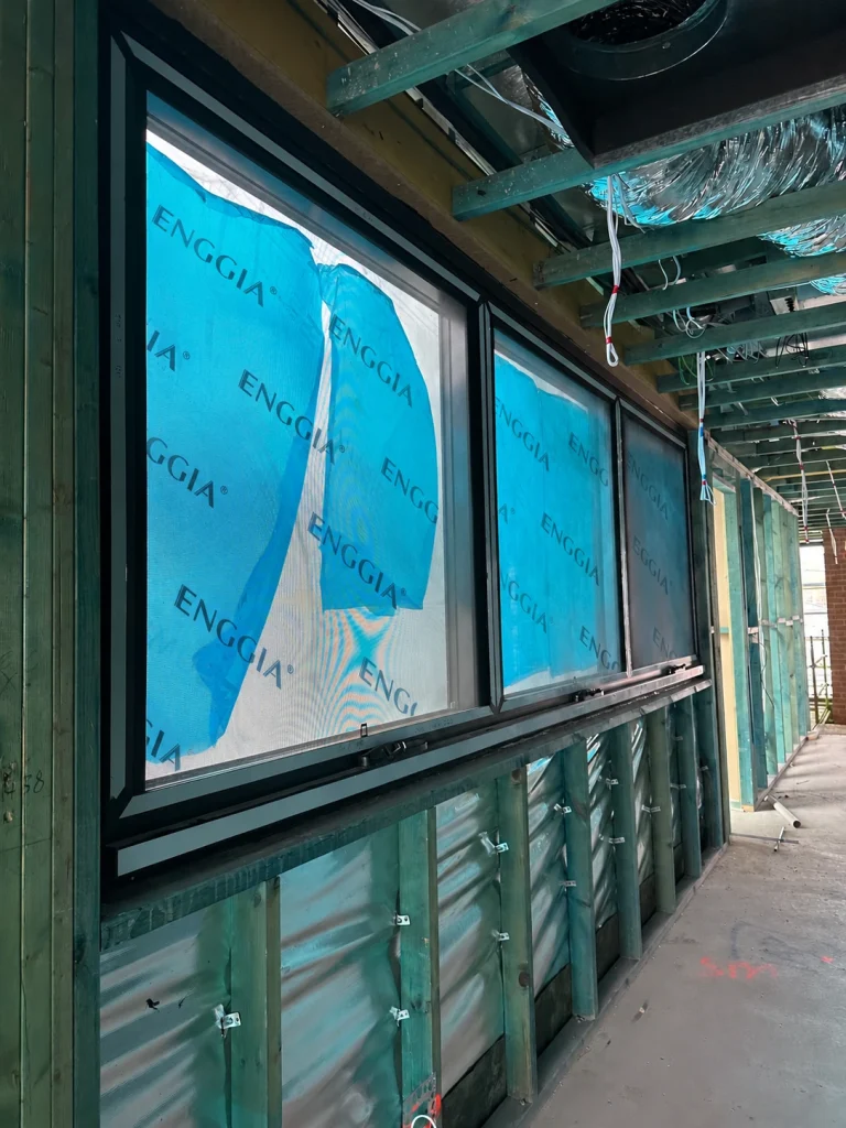 Window installation within unfinished metal wall framing