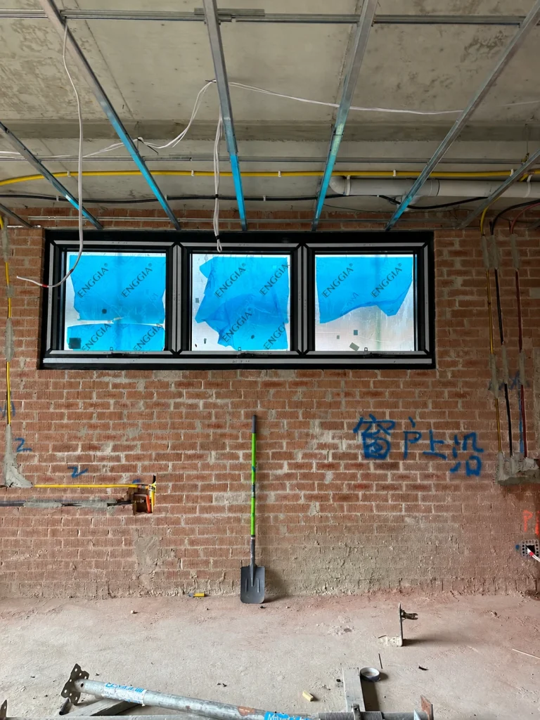 High-level windows installed in a brick wall