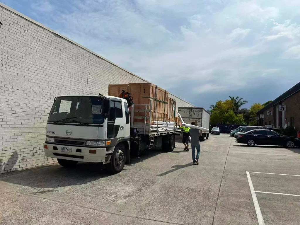 Truck delivering packaged window and door units