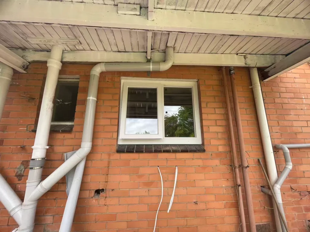 Completed small white-framed replacement window